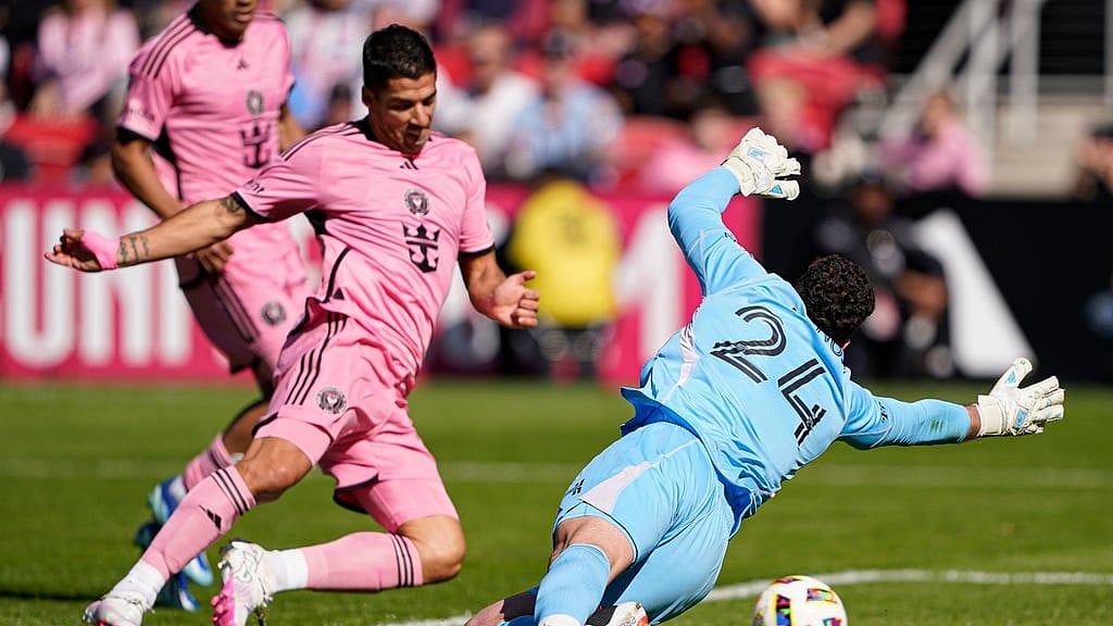 AP : Inter Miami striker Luis Suarez scores past DC United goalkeeper Alexander Bono during their Major League Soccer match at Audi Field, Washington.