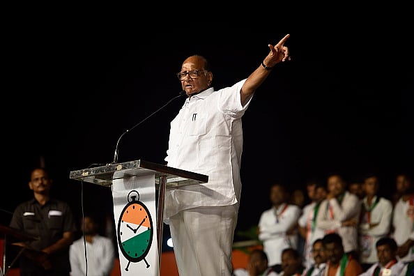Satish Bate/Hindustan Times via Getty Images) : National Congress Party (NCP) President Sharad Pawar addresses a campaign rally for NCP candidate Vijaysinh Pandit at Gavrai on October 12, 2019 in Beed, India. 