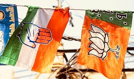 Bharatiya Janata Party (BJP), Indian National Congress (INC) Flags are seen together at a Flag Printing market in Old Delhi, India - null