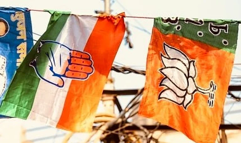 Bharatiya Janata Party (BJP), Indian National Congress (INC) Flags are seen together at a Flag Printing market in Old Delhi, India - null