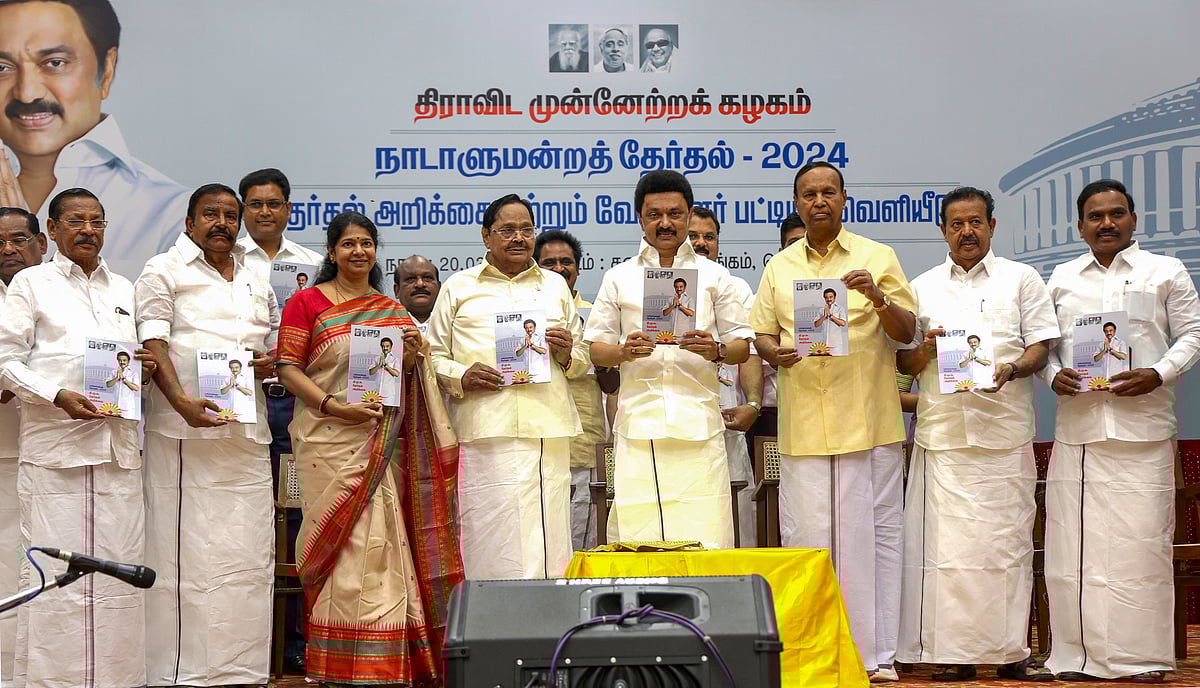 Photo via PTI Photo : Tamil Nadu CM and DMK chief MK Stalin with party leader Kanimozhi during the release of the party's candidates' list and manifesto during a party meeting, in Chennai, Wednesday, March 20, 2024. 