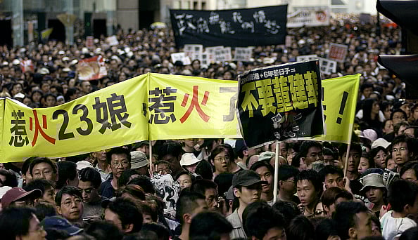 People protest during a rally against Article 23 legislation are pictured in Causeway Bay. - Getty Images