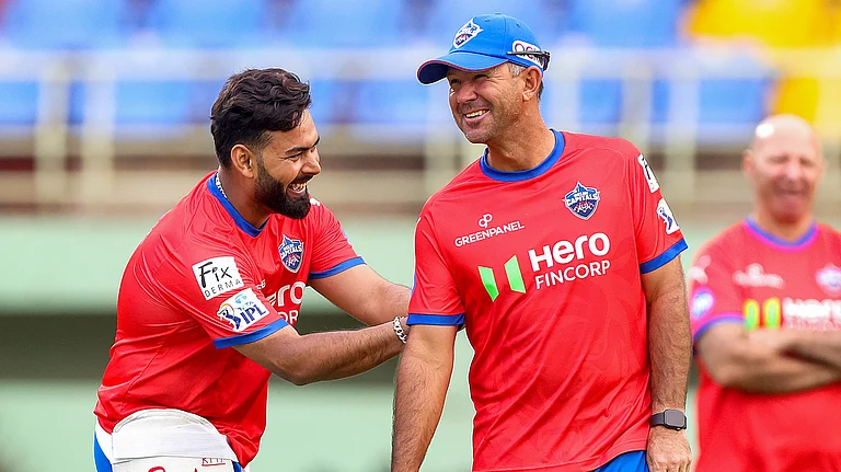 Delhi Capitals captain Rishabh Pant with head coach Ricky Ponting during a practice session on March 22, 2024, ahead of their Indian Premier League 2024 cricket match against Punjab Kings. - PTI