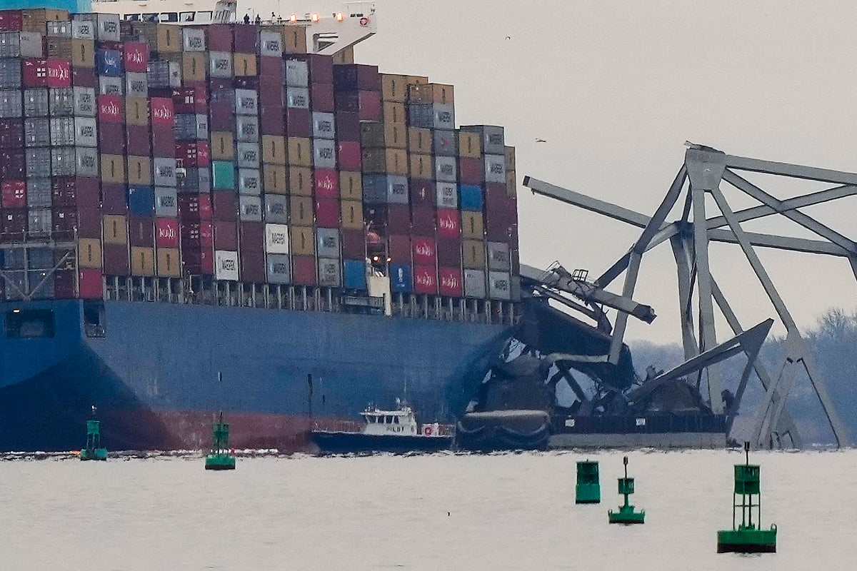 Matt Rourke : A container ship rests against wreckage of the Francis Scott Key Bridge on Wednesday, March 27, 2024, in Baltimore. 

