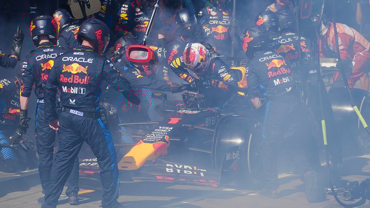 Mechanics work to extinguish a fire in Red Bull driver Max Verstappen of the Netherlands' car during the Australian Formula One Grand Prix at Albert Park, in Melbourne, Australia, Sunday, March 24, 2024. 

 - (AP Photo/Scott Barbour,Pool)
