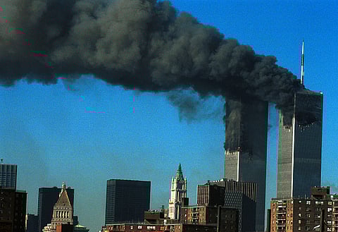 Smoke pours from the World Trade Center after being hit by two planes September 11, 2001 in New York City
