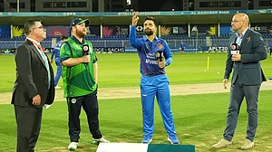 Photo: X/ @ACBofficials : Ireland captain Paul Stirling (L) with Afghan skipper Rashid Khan at the toss for the first T20I.