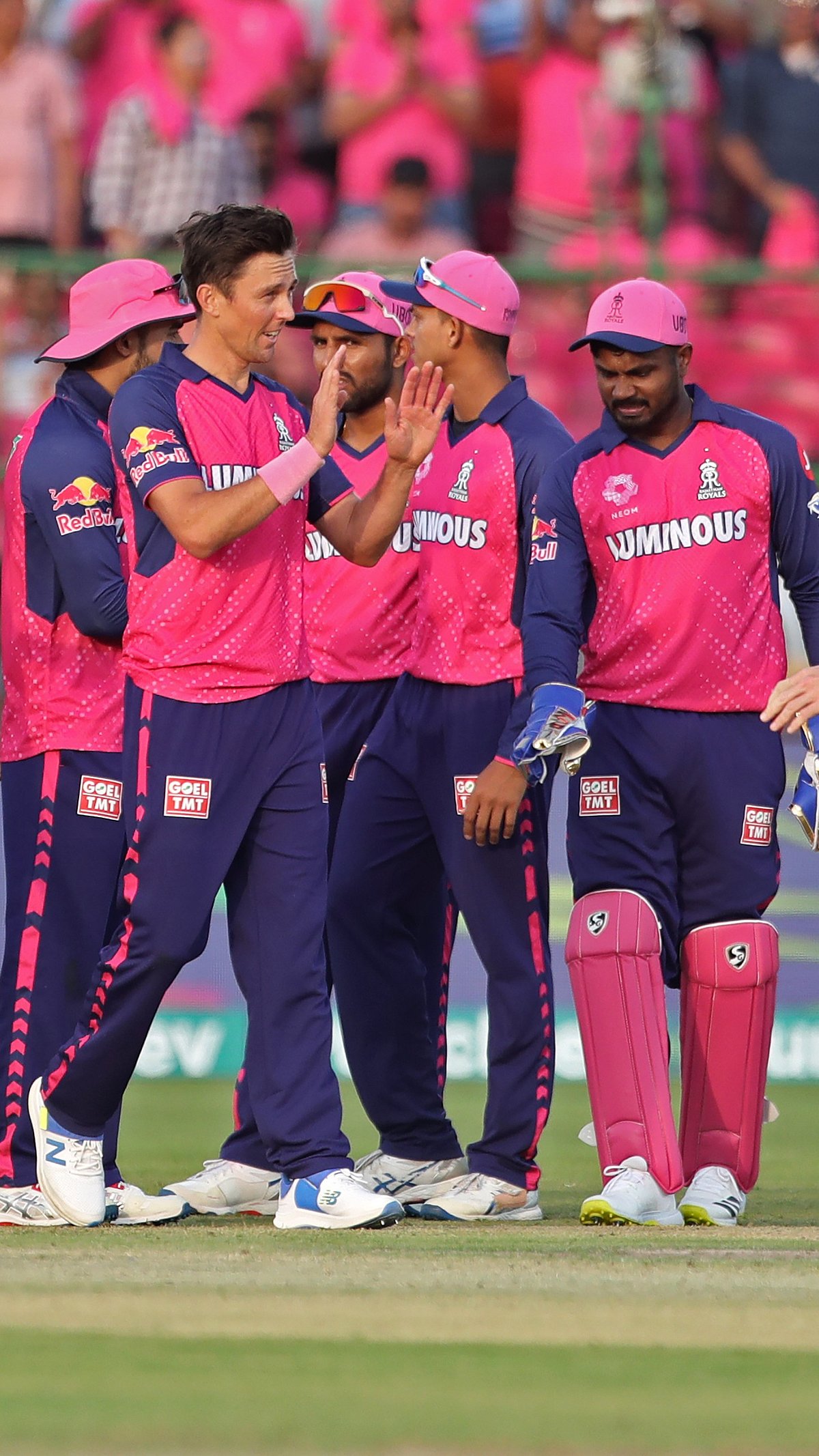AP Photo : Rajasthan Royals teammates celebrate the wicket of LSG batter in match 4 of the IPL 2024.