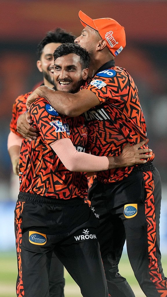AP : SRH players celebrate a MI wicket.
