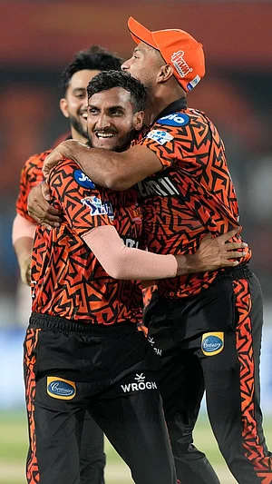 AP : SRH players celebrate a MI wicket.