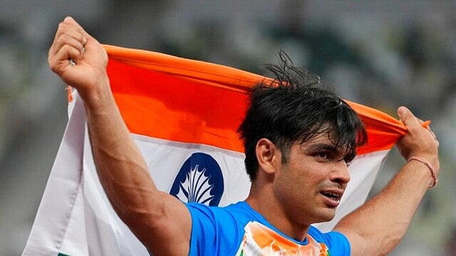 Indian athlete Neeraj Chopra with national flag - AP