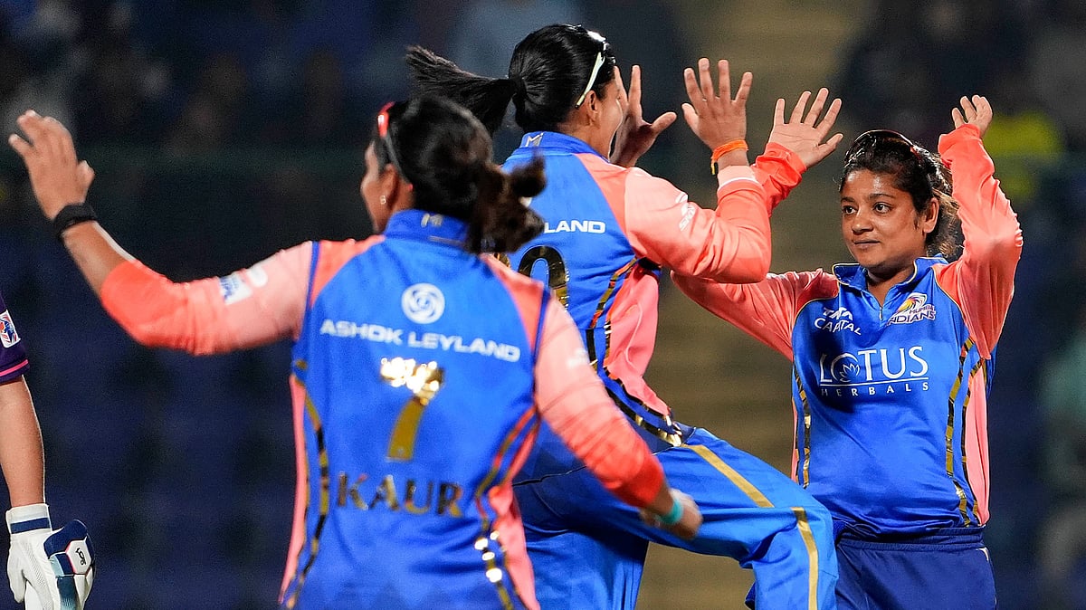Photo: PTI/Ravi Choudhary : Saika Ishaque celebrating with her teammates the wicket of UPW's Kiran Navgire in WPL 2024.