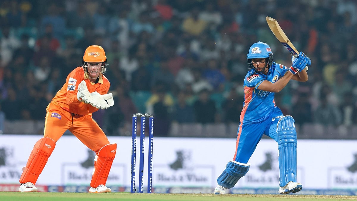 Photo: X/ @CricketinGenes : Mumbai Indians captain Harmanpreet Kaur playing a shot against Gujarat Giants in WPL 2024.
