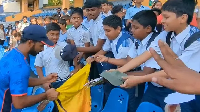 Ajinkya Rahane (left) signs autographs for the children at Wankhede Stadium. - X/BCCIdomestic