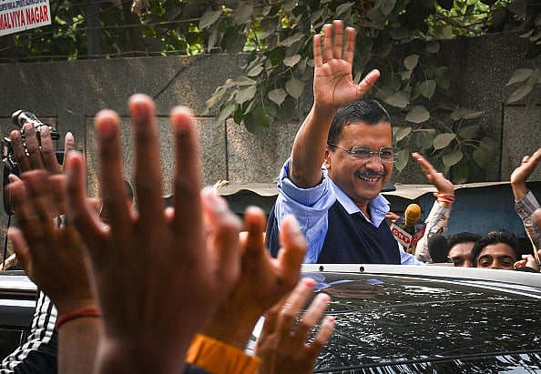Getty Images : Delhi Chief Minister Arvind Kejriwal seen along with his supporters during door to door election campaign in 2022