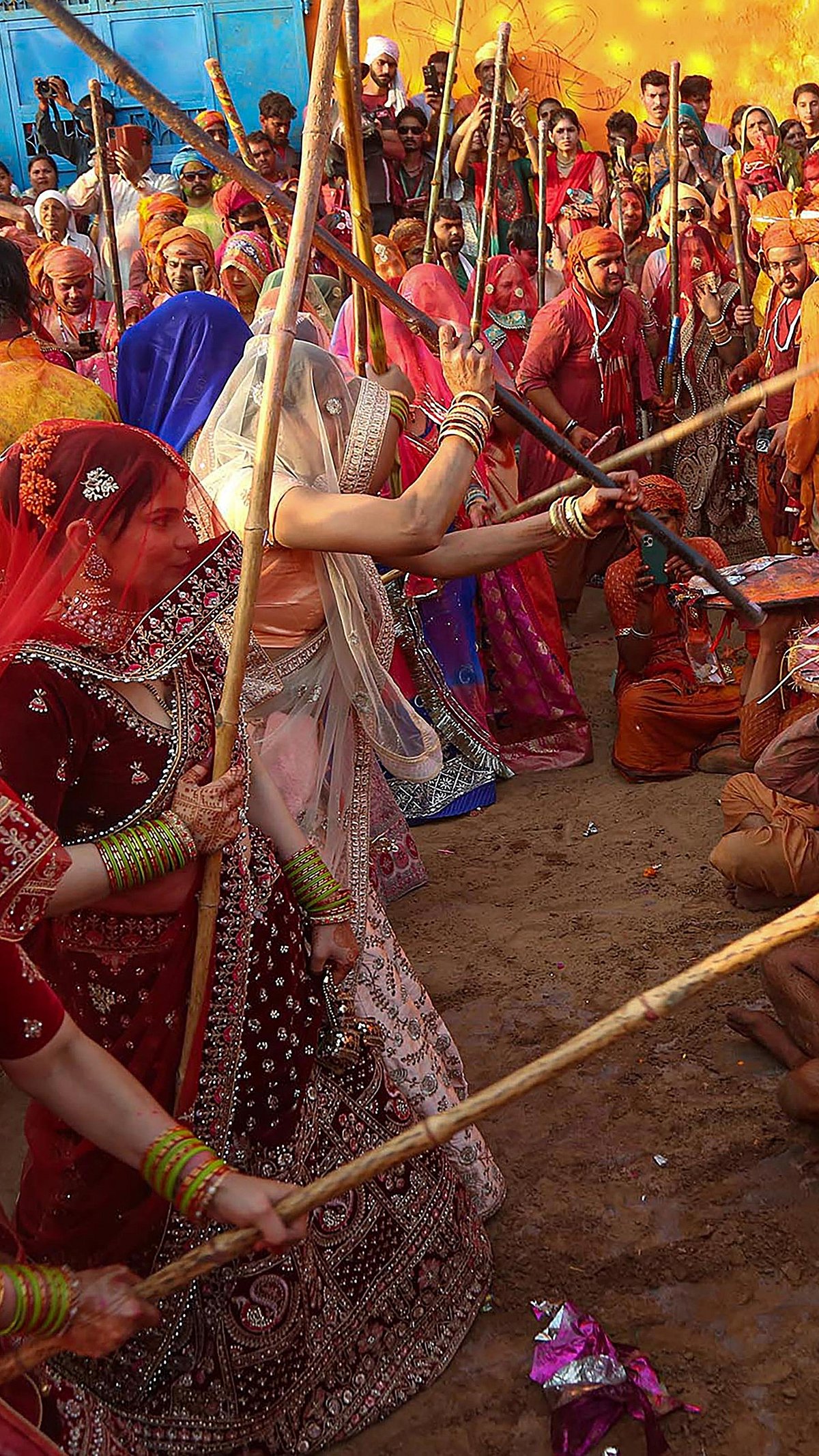 PTI : Men getting a ritual beating from women during 'Lathmar Holi' celebrations in Uttar Pradesh's Mathura