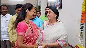 PTI : Sharad Pawar's daughter Supriya Sule (L) with Ajit Pawar's wife Sunetra Pawar (R) |