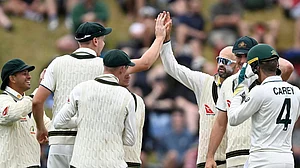 Andrew Cornaga/Photosport via AP : Nathan Lyon, third right, is congratulated by teammates after taking the wicket of Tom Blundell on Day 4 of the first Test match between New Zealand and Australia at the Basin Reserve in Wellington, Sunday (March 3, 2024).