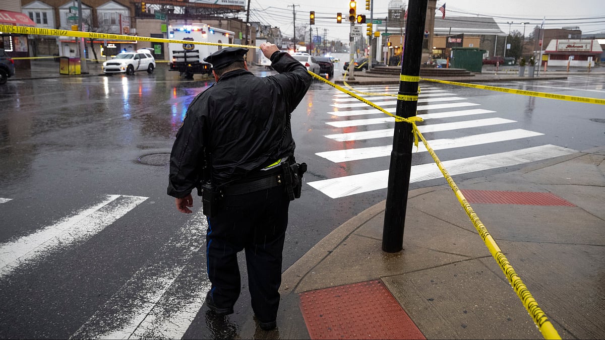 AP : An officer works on the scene following the shooting in Northeast Philadelphia.