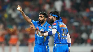 File : Mumbai Indians' Jasprit Bumrah, left, talks to captain Hardik Pandya during their Indian Premier League 2024 match.