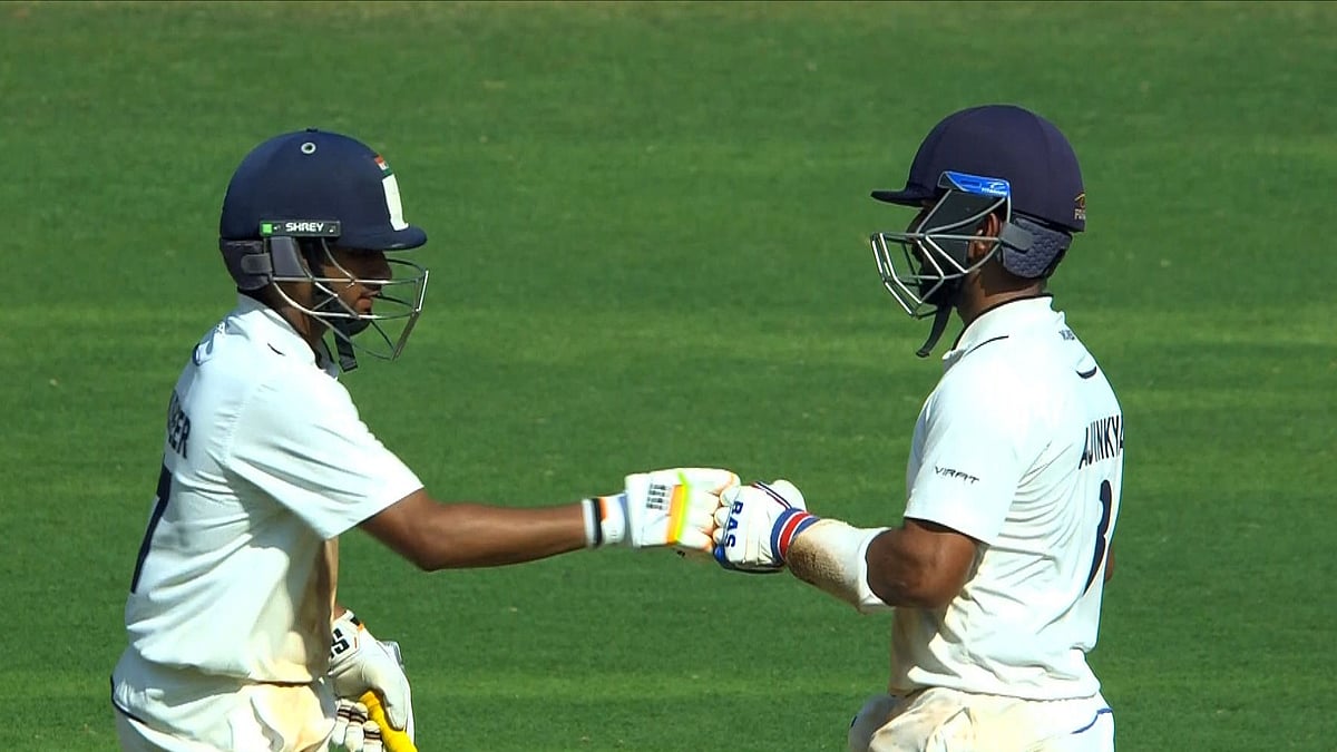 X/BCCI Domestic : Musheer Khan (left) and Ajinkya Rahane celebrate their 50-run partnership on Day 2 of the Mumbai vs Vidarbha, Ranji Trophy 2024 final at the Wankhede Stadium.
