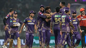 AP/BIKAS DAS : KKR players celebrate after clinching a nervy four-run win over SRH.