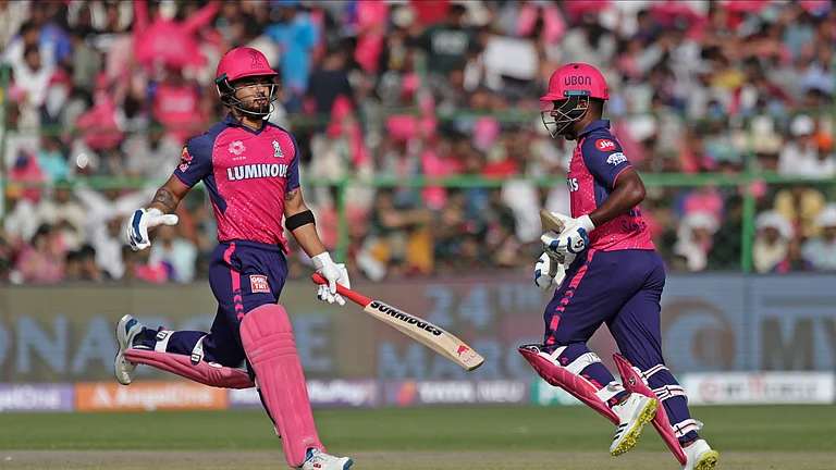 Rajasthan Royals' captain Sanju Samson, right, and Riyan Parag run between the wickets to score during the Indian Premier League cricket match between Rajasthan Royals and Lucknow Super Giants in Jaipur. - AP Photo/Pankaj Nangia