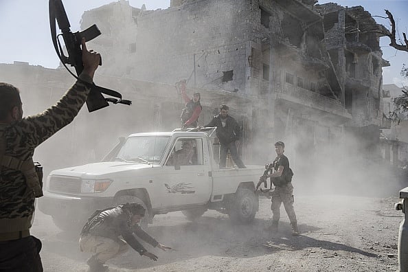 Getty Images : Members of Free Syrian Army (FSA) celebrate in Syria's Al Bab, after taking control of the district's centrum (representative image)