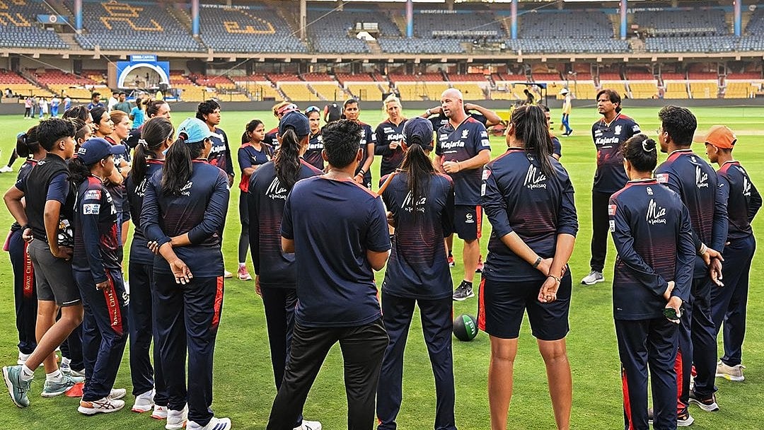 Photo: X/ @RCBTweets : Royal Challengers Bangalore Women team with coaches and support staff before the match against MI Women in Bengaluru.