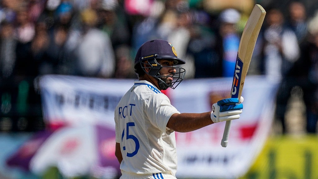 AP : Indian skipper Rohit Sharma reacts after notching his 12th Test career ton.