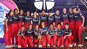 WPL T20 website : Royal Challengers Bangalore celebrate with the trophy after winning the Women's Premier League 2024 title at the Arun Jaitley Stadium in Delhi on Sunday (March 17).