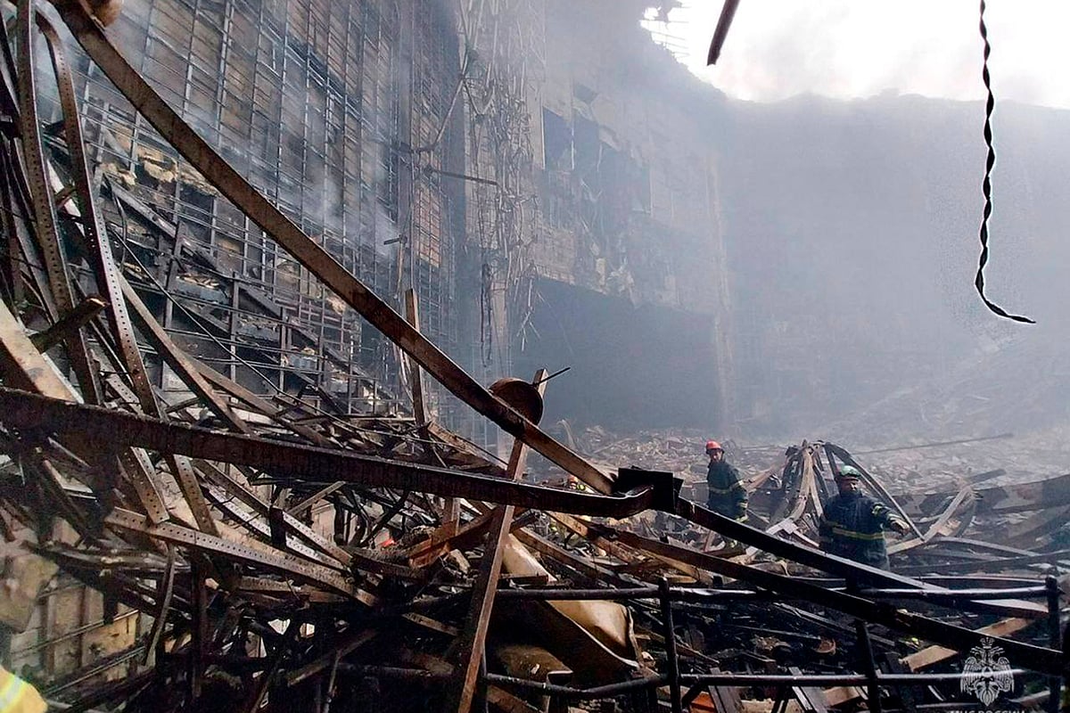(Russian Emergency Ministry Press Service via AP) : In this photo released by Russian Emergency Ministry Press Service on Saturday, March 23, 2024, firefighters work in the burned concert hall after an attack on the building of the Crocus City Hall on the western edge of Moscow, Russia.