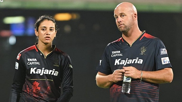 Photo: X/ @RCBTweets : RCB captain Smriti Mandhana (L) with coach Luke Williams before the game against MI in WPL 2024.
