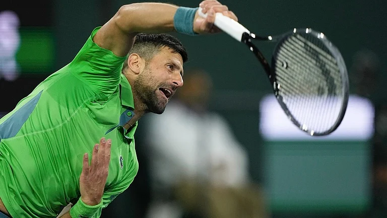 Novak Djokovic, of Serbia, serves to Luca Nardi, of Italy, at the BNP Paribas Open tennis tournament Monday, March 11, 2024, in Indian Wells, Calif. Nardi won 6-4, 3-6, 6-3.
- (AP Photo/Mark J. Terrill)