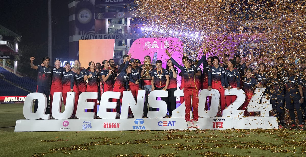 Royal Challengers Bangalore players celebrate after winning the WPL 2024 final against Delhi Capitals at the Arun Jaitley Stadium in New Delhi on March 17, 2024. - PTI