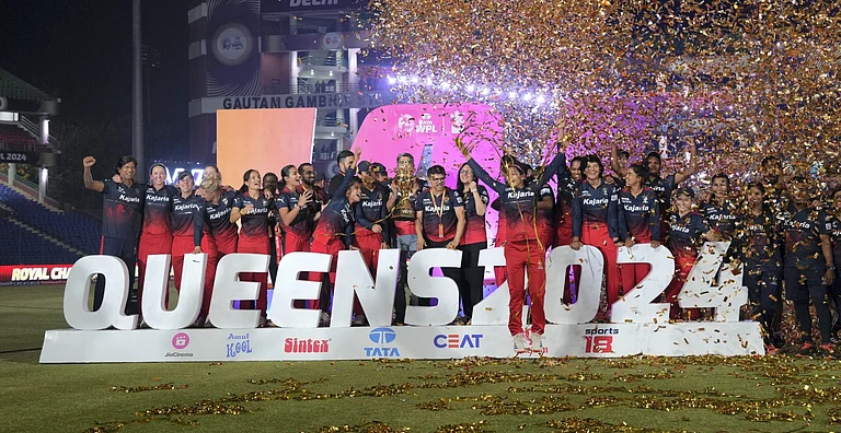 Royal Challengers Bangalore players celebrate after winning the WPL 2024 final against Delhi Capitals at the Arun Jaitley Stadium in New Delhi on March 17, 2024. - PTI