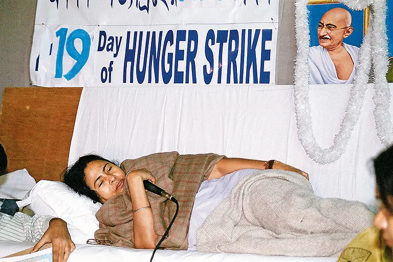A Mass Leader (Top) Mamata Banerjee during her Singur hunger strike, Mamata walking with Nandigram victims in Delhi  - Photo: Getty Image