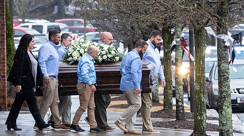 The casket of Laken Riley, the 22-year-old nursing student who was killed last week on the University of Georgia campus, is brought to a hearse following her funeral at Woodstock City Church in Woodstock.
