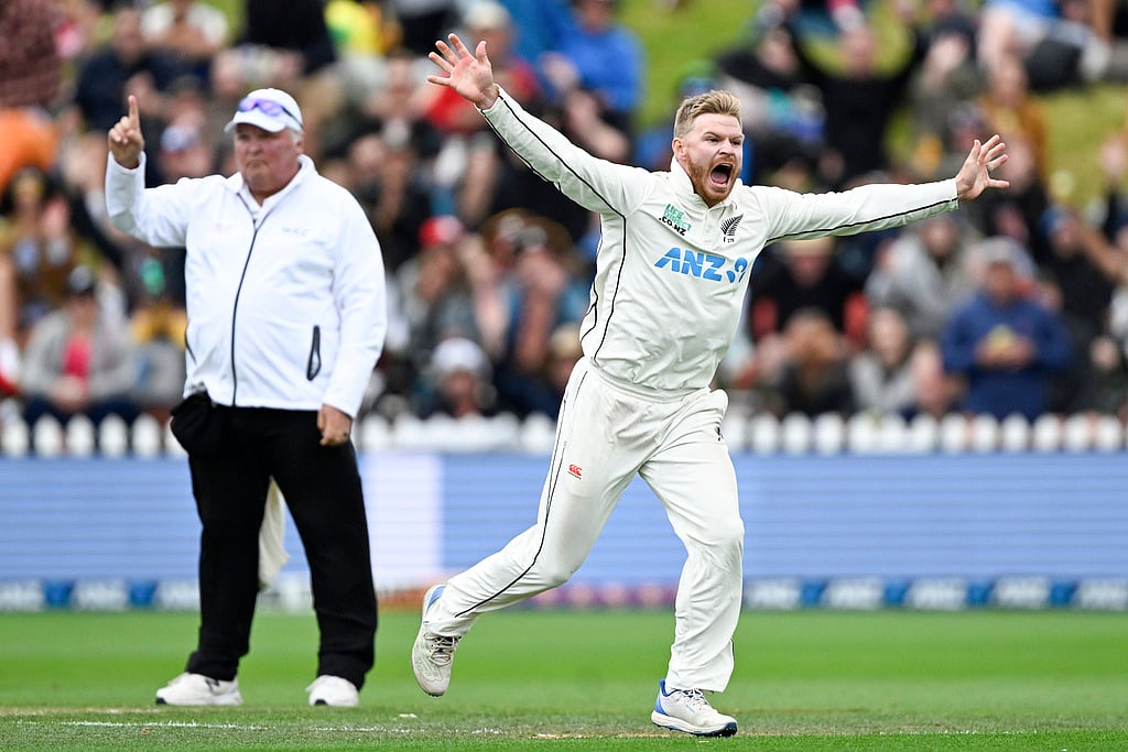 Andrew Cornaga/Photosport via AP             : Glenn Phillips (right) celebrates the wicket of Cameron Green on day 3 of the first Test match between New Zealand and Australia at the Basin Reserve in Wellington on March 2, 2024.