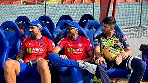 Photo: X/ @PunjabKingsIPL : Delhi Capitals' Ishant Sharma (L), Axar Patel with Punjab Kings' vice captain Jitesh Sharma in practice session.