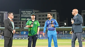 Photo: X/ @ACBofficials : Afghanistan captain Rashid Khan (R) with Irish captain Paul Stirling at the toss time in the 3rd T20I match.