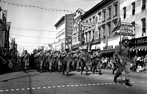 A military unit marches during the Savannah St. Patrick's Day parade, March 16, 1957.