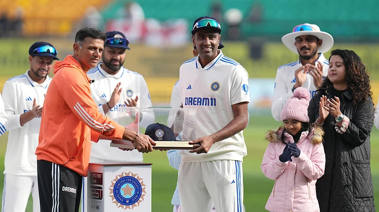 India's head coach Rahul Dravid presents the 100th Test cap to Ravichandran Ashwin before the start of the fifth Test cricket match between India and England, in Dharamshala, Thursday, March 7, 2024. - X/ICC