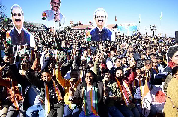 Photo via Getty Images : Congress supporters celebrating victory after winning in Himachal Pradesh state elections..