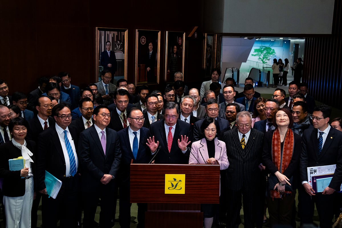 President of the Legislative Council Andrew Leung (centre), and lawmakers attend a press conference following the passing of the Basic Law Article 23 legislation - AP