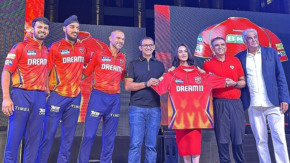 Photo: X/ @PunjabKingsIPL : Punjab Kings team players and franchise owners inaugurated the new jersey for the IPL 2024.
