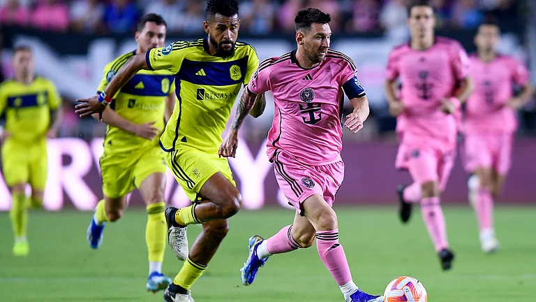 Inter Miami forward Lionel Messi races ahead of Nashville SC midfielder Anibal Godoy during the first half of a CONCACAF Champions Cup soccer match Wednesday, March 13, 2024, in Fort Lauderdale, Fla.
- (AP Photo/Michael Laughlin)