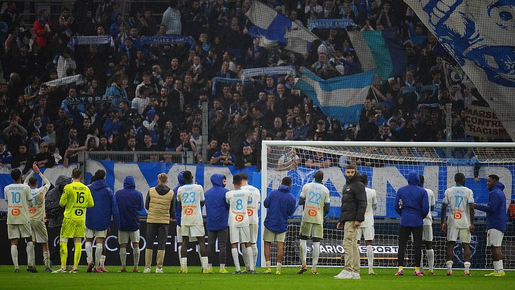 AP : Marseille players celebrate after the French League 1 match against Montpellier at the Stade Velodrome in Marseille, France on February 25, 2024. Marseille won 4-1.
