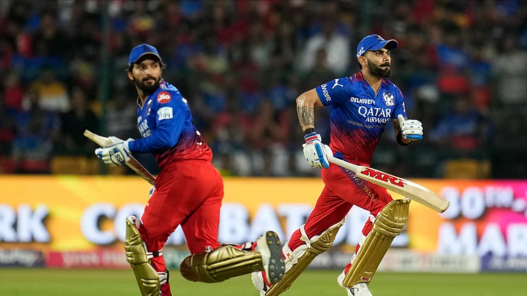 Royal Challengers Bengaluru's Virat Kohli, right, and Rajat Patidar run between the wickets to score during the Indian Premier League 2024 match between Royal Challengers Bengaluru and Punjab Kings in Bengaluru. - File