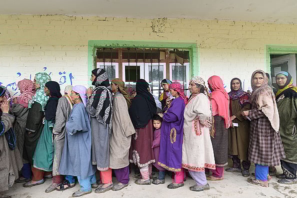 Voters queue up to cast their votes outside a polling station during the second phase of Lok Sabha elections, at Chill, on April 18, 2019 in Budgam district | - Getty Images